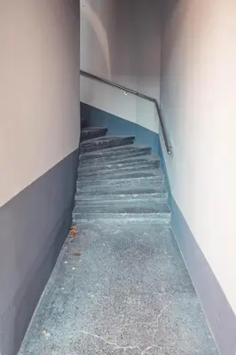 a stairway in a building with blue steps at Maribella Apartment II in Maribor
