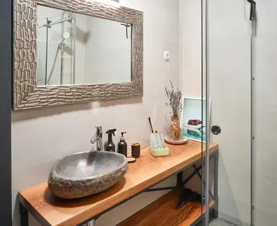 a bathroom with a sink and a mirror at Apartmaji Remsova in Maribor