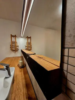 a bathroom with a sink and a counter top at Parzival relax Apartment in Žetale