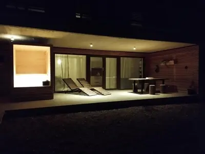 a room with chairs and a table on a house at Parzival relax Apartment in Žetale