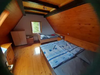 an overhead view of a room with a bed at Owl's Nest Bovec in Bovec