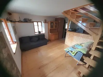 an overhead view of a living room with a couch and stairs at Owl's Nest Bovec in Bovec
