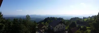 an aerial view of a house on a hill at Turizem Pavlin Apartments in Šenturska Gora