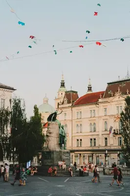 a group of kites flying in the sky over a city at Walter Apartment City Center in Ljubljana