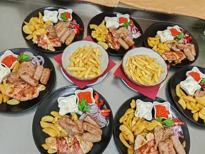 a bunch of plates of food on a table at Gostilna The RIVER in Dravograd