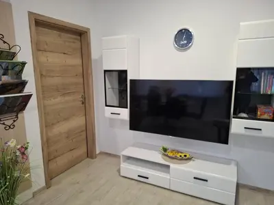 a living room with a large flat screen tv at Prenočišča Dany APARTMA 2 in Dravograd