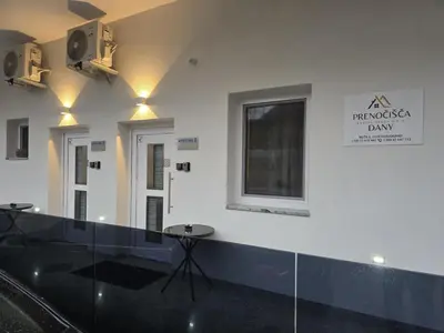 a room with a glass counter and a window and a table at Prenočišča Dany APARTMA 2 in Dravograd