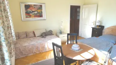 a living room with a couch and a table at Marta's House in Bled