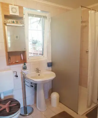 a bathroom with a sink and a shower at Marta's House in Bled