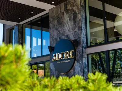 a sign on the side of a building at Hotel Adore in Ljubljana