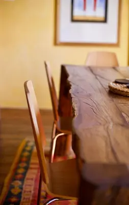 a wooden table with two chairs and a wooden table with at Room for 2 - Pri B'zjak in Kobarid