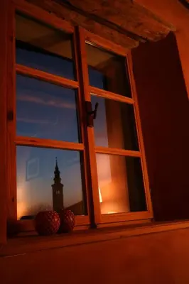 an open window with a view of a lighthouse at Room for 2 - Pri B'zjak in Kobarid