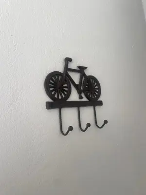 a small bike on a wall hanging on a wall at Vila Malina in Gaberje