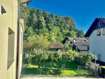 a view of a yard with trees and houses at New comfortable and cute one-room apartment of 33 m2 in Ljubljana