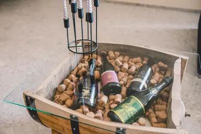 a container filled with bottles of wine and a table at Beg Residence in Rogaška Slatina