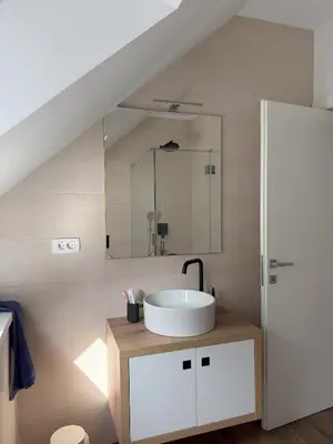 a bathroom with a sink and a mirror at Charming house in Gozd Martuljek in Gozd Martuljek