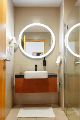 a bathroom with a sink and a mirror at Apartma Masada in Maribor