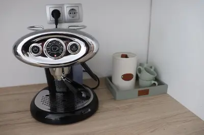 a small black blender sitting on a wooden table at Apartment Valis in Velenje