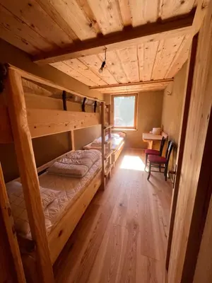 a room with two bunk beds in a cabin at Ethno holistic village Apače in Apače