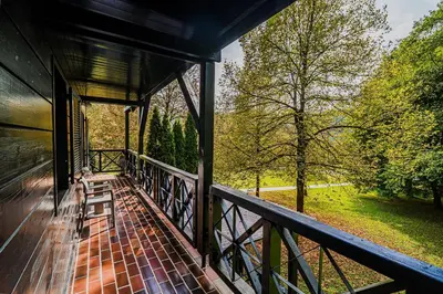 a balcony of a house with a view of trees at Apartment Luna 65 in Podčetrtek
