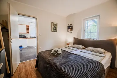 a bedroom with a bed with two towels on it at Apartment Luna 65 in Podčetrtek