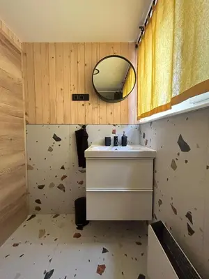 a bathroom with a sink and a mirror at La - Mai Glamping in Žetale