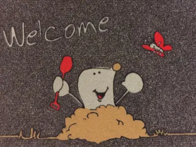 a picture of a tooth with a welcome sign and butterflies at TiliaStay in Ljubljana