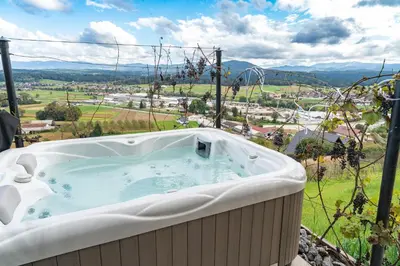 a jacuzzi tub sitting on top of a hill at Hill Stars House in Straža