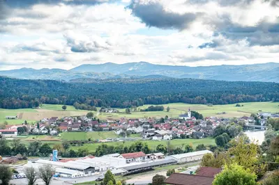 a small town in a valley with mountains in the background at Hill Stars House in Straža