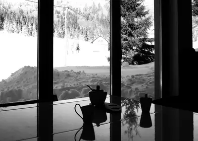a window with a view of a snow covered mountain at Chalet Aurora