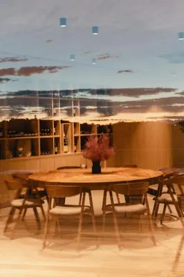 a wooden table with a vase on top of it at Emeran Reya Estate in Šmartno