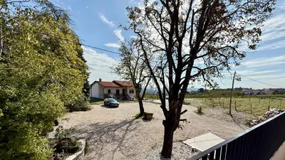a car parked in the driveway of a house at Emeran Reya Estate in Šmartno
