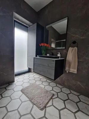 a bathroom with a sink and a mirror at Vila Marina in Prestranek
