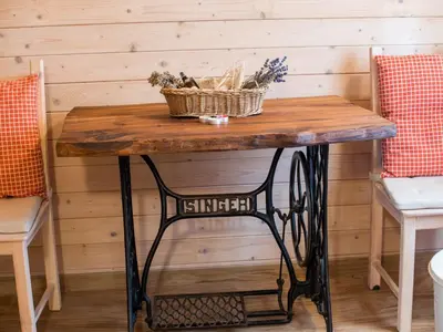 a wooden table with a wicker basket on top at Serene Rustic Haven Holiday Home with Sauna - Two Bedroom Holiday Home with Sauna in Bistrica ob Sotli