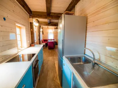a kitchen with a sink and a refrigerator at Serene Rustic Haven Holiday Home with Sauna - Two Bedroom Holiday Home with Sauna in Bistrica ob Sotli