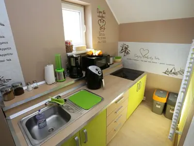 a small kitchen with a sink and a counter top at Elegant and Stylish Retreat Apartments with Terrace - Three Bedroom Apartment with Terrace in Brežice