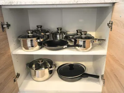 a bunch of pots and pans on a shelf at Relax and Rustic Apartments with Terrace - Standard One Bedroom Apartment with Terrace in Brežice