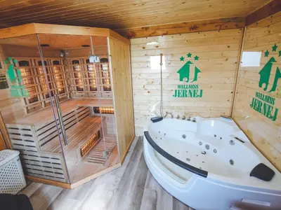 a sauna with a tub in a wooden room at Relax and Rustic Apartments with Terrace - Standard One Bedroom Apartment with Terrace in Brežice