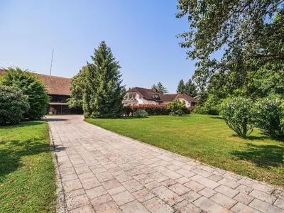 a brick driveway in front of a house at Stunning Rural Holiday Home with Garden and BBQ - Four Bedroom Holiday Home in Brežice