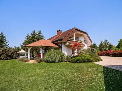 a house with a gazebo in a yard at Stunning Rural Holiday Home with Garden and BBQ - Four Bedroom Holiday Home in Brežice
