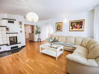 a living room with a couch and a coffee table at Stunning Rural Holiday Home with Garden and BBQ - Four Bedroom Holiday Home in Brežice