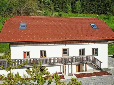 a white house with a red roof at Mountain View Villa with Sauna and Hot-Tub - Three Bedroom Villa with Sauna and Hot-Tub in Slovenj Gradec