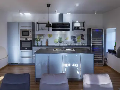 a kitchen with stainless steel cabinets and a sink at Mountain View Villa with Sauna and Hot-Tub - Three Bedroom Villa with Sauna and Hot-Tub in Slovenj Gradec