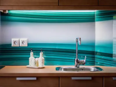 a kitchen sink with two bottles on top of it at Riverside Pines Luce Apartments with Balcony - One Bedroom Apartment with Balcony in Luče