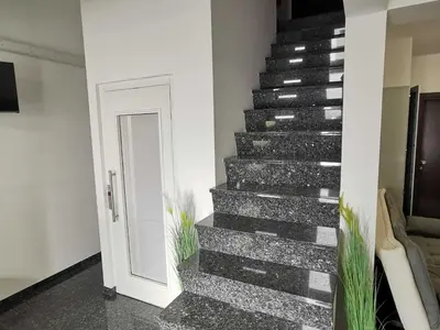a stairway with a black and white staircase at Bled Prestigious and Stylish Apartments - Classic One Bedroom Apartment with Balcony in Bled