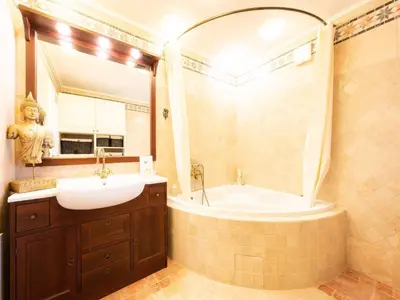 a bathroom with a tub and a sink and a mirror at Secluded Escape Hilltop Villa with Hot-Tub - Two Bedroom Villa with Hot-Tub