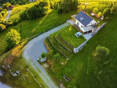 an aerial view of a house with a road next to it at Secluded Escape Hilltop Villa with Hot-Tub - Two Bedroom Villa with Hot-Tub