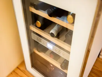 a cabinet filled with bottles of wine at Secluded Escape Hilltop Villa with Hot-Tub - Two Bedroom Villa with Hot-Tub