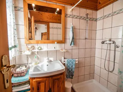 a bathroom with a sink and a shower and a mirror at Cozy Countryside Retreat Villa with Hot-Tub - Two Bedroom Villa with Hot Tub