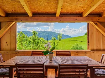 a wooden table in a room with a large window at Nature Hideaway Holiday Homes with Sauna - One Bedroom Holiday Home in Slappe dʼIdria